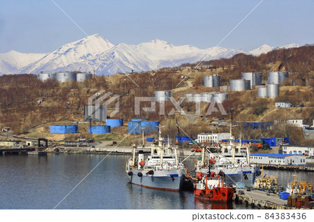 Fishing vessels against the background of tankers of an oil depot in the port of Petropavlovsk-Kamchatsky. 84383436