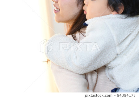 Image of mother and son (parent and child) doing piggyback ride 84384175