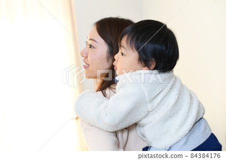 Image of mother and son (parent and child) doing piggyback ride 84384176