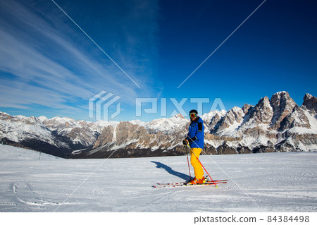 Alpine skier on slope at Cortina Alpine skier on slope at Cortina 84384498