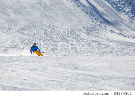 Alpine skier on slope at Cortina 84384501