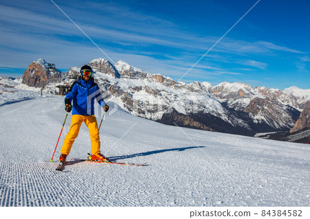 Alpine skier on slope at Cortina 84384582