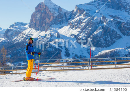 Happy skier on slope at Cortina 84384590