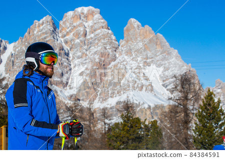 Happy skier on slope at Cortina Happy skier on slope at Cortina 84384591