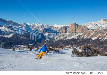 Alpine skier on slope at Cortina 84384593