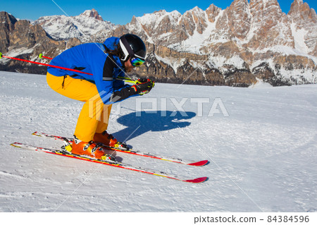 Alpine skier on slope at Cortina 84384596