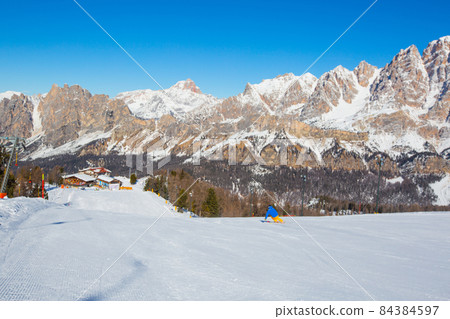 Alpine skier on slope at Cortina 84384597