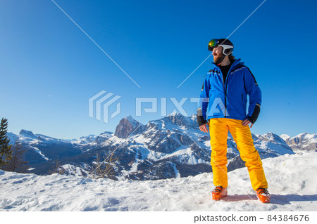 Happy skier on slope at Cortina 84384676