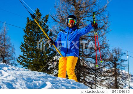 Alpine skier with T-bar lift 84384685