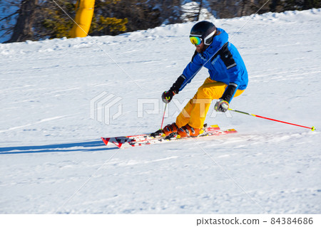 Alpine skier on slope at Cortina Alpine skier on slope at Cortina 84384686