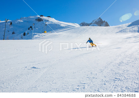 Alpine skier on slope at Cortina 84384688