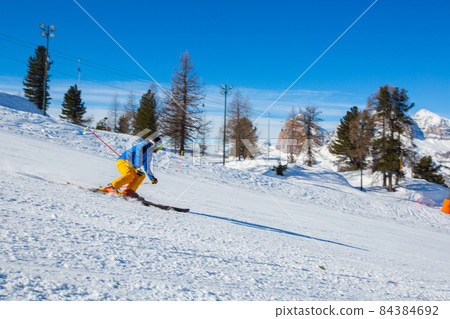 Alpine skier on slope at Cortina Alpine skier on slope at Cortina 84384692