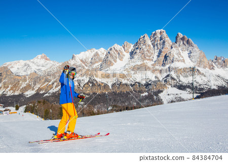 Alpine skier on slope at Cortina Alpine skier on slope at Cortina 84384704