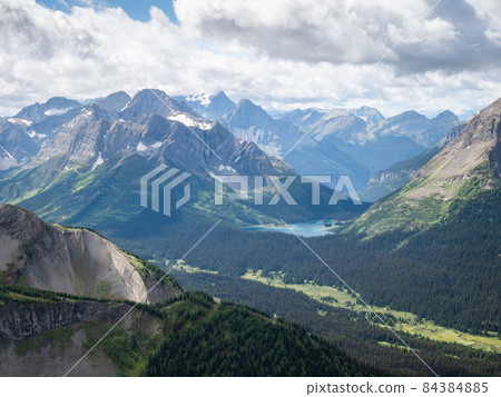 Beautiful green alpine valley with tarns and mountain peaks, Canadian Rockies, Canada Beautiful green alpine valley with tarns and mountain peaks, Canadian Rockies, Canada 84384885
