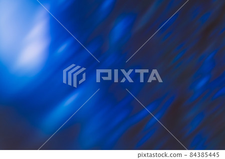 Defocused glow background. Blur rays. Night sky moonlight. Lens flare effect. Bokeh blue black white light flecks pattern dark abstract overlay. Defocused glow background. Blur rays. Night sky moonlight. Lens flare effect. Bokeh blue black white light flecks pattern dark abstract overlay. 84385445