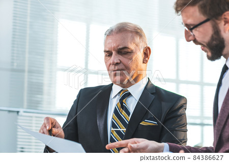 close up. serious business colleagues discussing new data 84386627