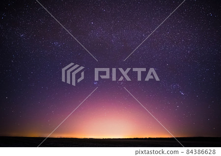 Real Night Sky Stars Background With Natural Colourful Sky Gradient. Sunset, Sunrise Light And Starry Sky. Yellow And Magenta Colors Real Night Sky Stars Background With Natural Colourful Sky Gradient. Sunset, Sunrise Light And Starry Sky. Yellow And Magenta Colors 84386628