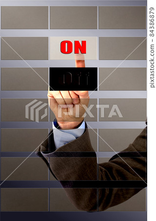 The hand of man presses a button. The hand of man presses a button. 84386879