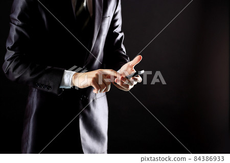 Young businessman working with modern devices, digital tablet computer and mobile phone. Young businessman working with modern devices, digital tablet computer and mobile phone. 84386933