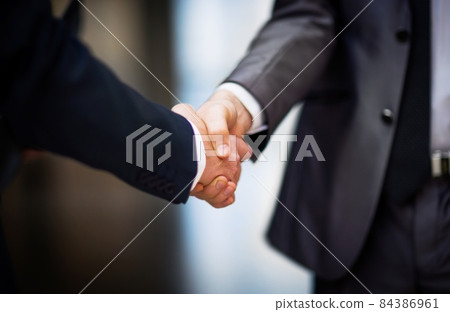 Business people shaking hands Business people shaking hands 84386961
