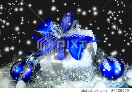 estive balls with gift box on snow estive balls with gift box on snow 84386969