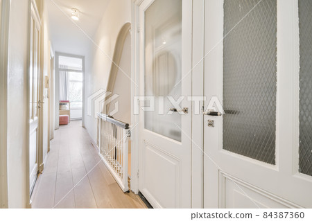 Modern room with wooden floor and white walls Modern room with wooden floor and white walls 84387360