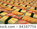 3D render a lot of Japanese sushi with a small depth of field Sushi rolls scattered on white background 84387756