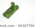 3D rendering isometric village house with green trees and grass 84387760