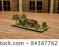 3d rendering Projection on the phone of an old house and trees with grass. concept of village, old, summer 84387762