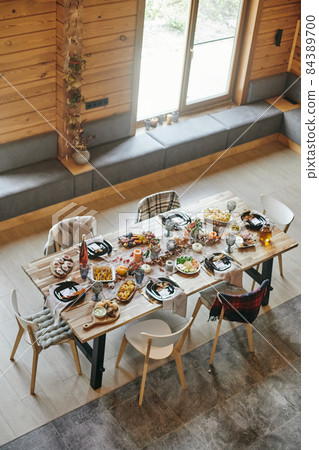 Served festive table with kitchenware, homemade food and decorations 84389700