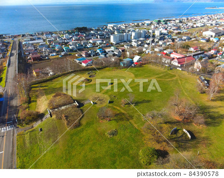 Aerial view of the world heritage Irie shell mound in Toyako, Hokkaido in late autumn Aerial view of the world heritage Irie shell mound in Toyako, Hokkaido in late autumn 84390578