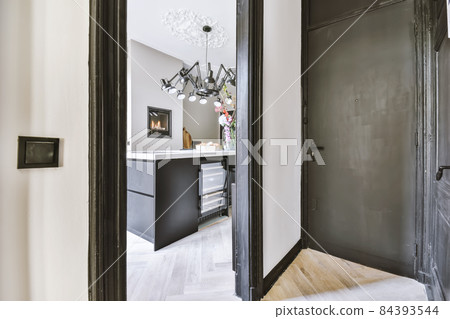 Stylish and modern white corridor with black door frames 84393544