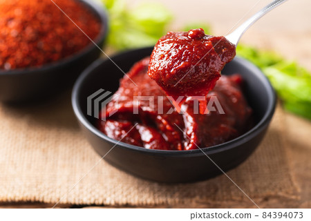 Korean gochujang (red chili paste), spicy and sweet fermented condiment in Korean food Korean gochujang (red chili paste), spicy and sweet fermented condiment in Korean food 84394073