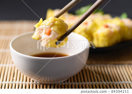 Shrimp shumai, Open-topped dumpling filled with chopped shrimp, Traditional Chinese steamed dumpling 84394151