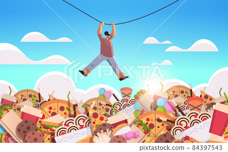 woman hanging rope above junk food assortment of fast food unhealthy nutrition junkfood addiction concept woman hanging rope above junk food assortment of fast food unhealthy nutrition junkfood addiction concept 84397543