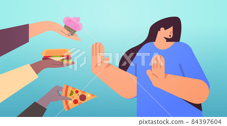 woman showing no stop gesture to junk food unhealthy nutrition junkfood addiction stop fast food concept 84397604