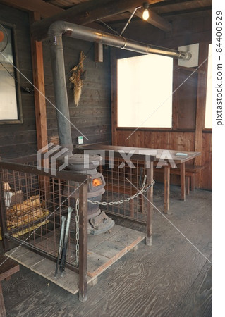 A potbelly stove that burns and uses firewood that is rarely seen 84400529