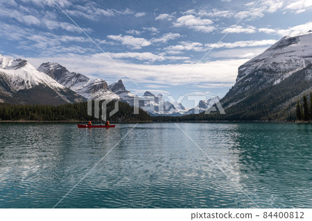 Tourists canoeing into the Spirit Island on Maligne lake at Jasper national park, Canada 84400812