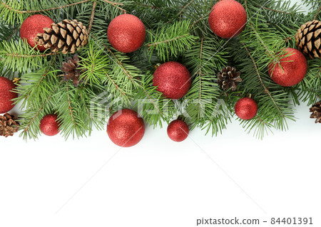 Spruce branches with Christmas baubles isolated on white background 84401391