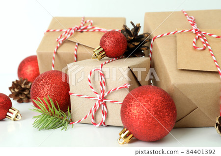 Gift boxes and Christmas accessories on white table Gift boxes and Christmas accessories on white table 84401392