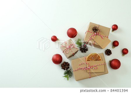 Gift boxes and Christmas accessories on white background Gift boxes and Christmas accessories on white background 84401394
