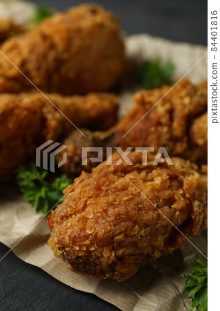Concept of tasty eating with fried chicken, close up Concept of tasty eating with fried chicken, close up 84401816