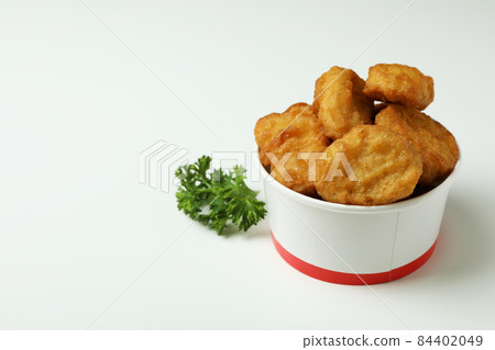Bucket with fried chicken on white background 84402049