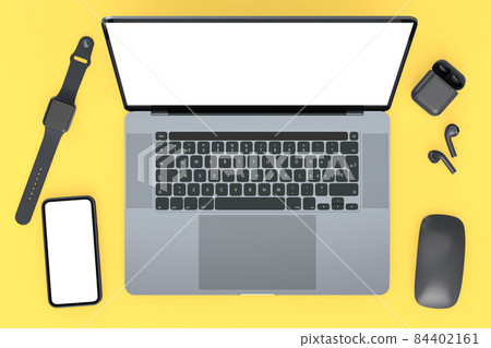 Aluminum laptop with mouse, smartwatch, phone and headphones on yellow Aluminum laptop with mouse, smartwatch, phone and headphones on yellow 84402161
