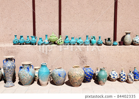 Traditional iranian souvenirs - colorful clay pots and jugs, Iran Traditional iranian souvenirs - colorful clay pots and jugs, Iran 84402335
