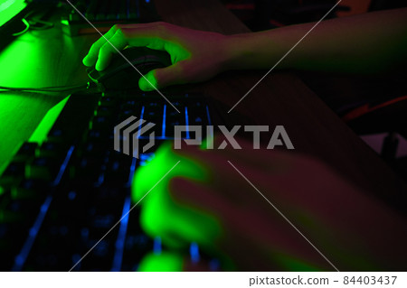 Cyber sport. Team play. Professional cybersport player training or playing online game on his PC 84403437