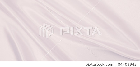 Smooth elegant pink silk or satin texture as wedding background. Luxurious background design Smooth elegant pink silk or satin texture as wedding background. Luxurious background design 84403942