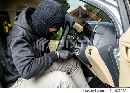 Car thief man trying to steal the car 84403981