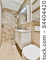 Interior of small clean restroom in miniature style 84404420