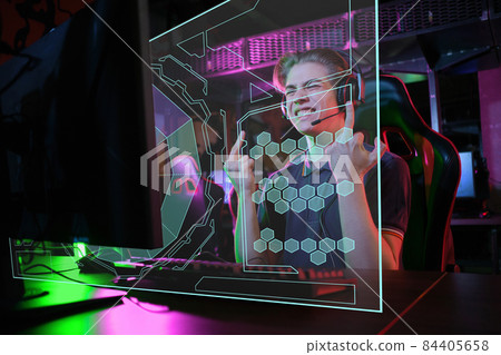 Professional young caucasian gamer playing online on his PC. He upset because of losing the game Professional young caucasian gamer playing online on his PC. He upset because of losing the game 84405658